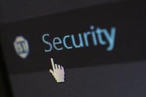 Cursor hand points to security button. Source: Pixabay